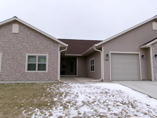 single story home featuring a garage