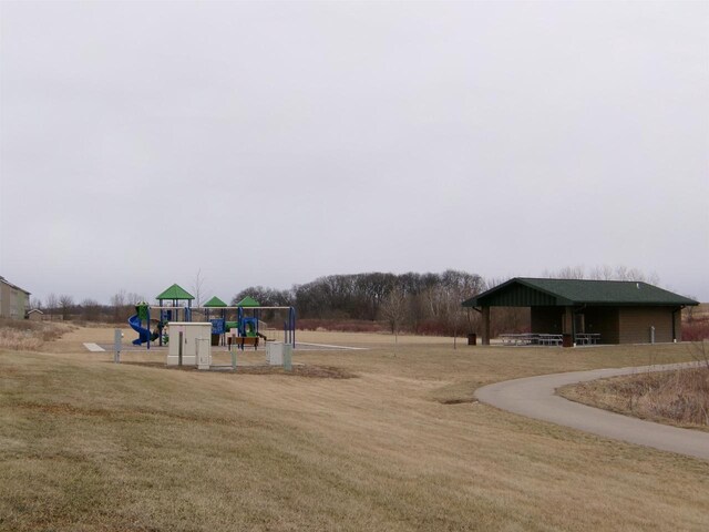 view of playground with a yard