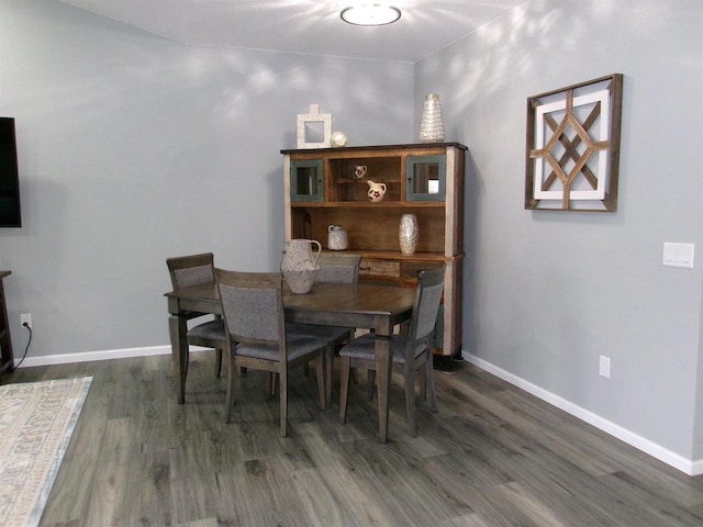 dining space featuring dark hardwood / wood-style flooring