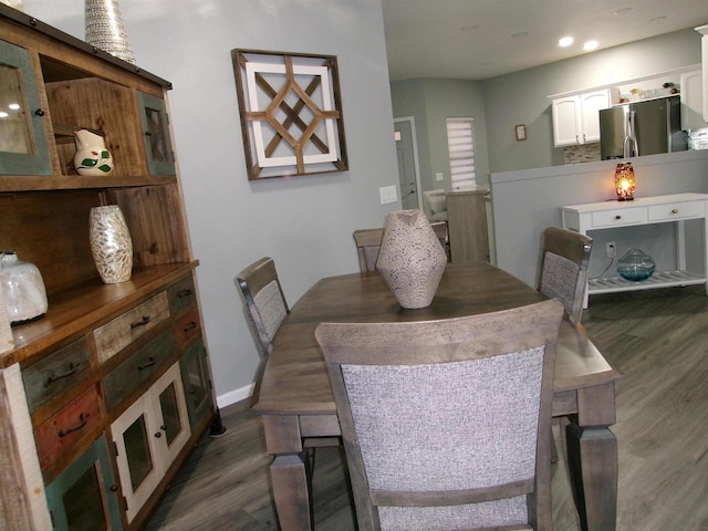 dining area featuring dark hardwood / wood-style floors