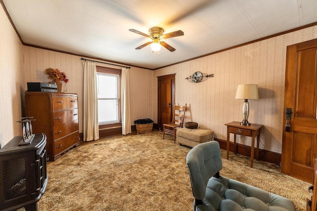 living area featuring ceiling fan, ornamental molding, and carpet flooring