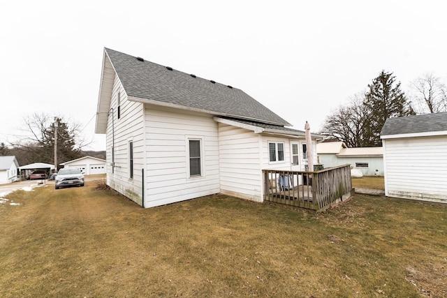 back of house with a yard and a deck