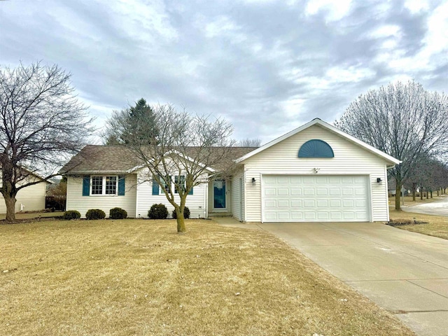 ranch-style house featuring a garage and a front lawn