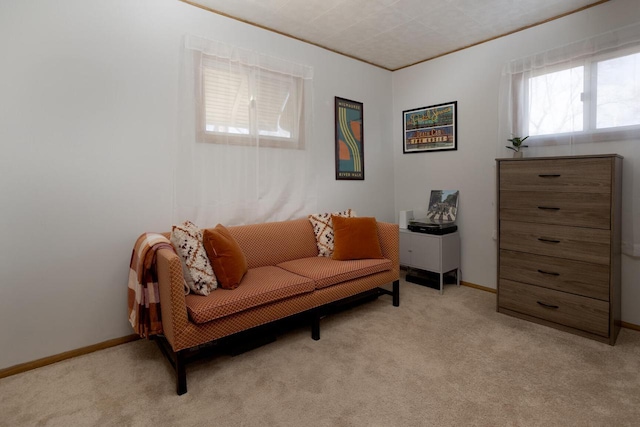 living area with light carpet and crown molding