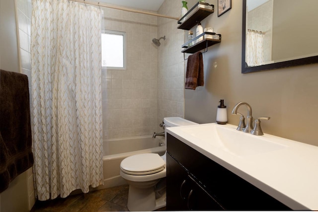 full bathroom with shower / bath combo, vanity, and toilet