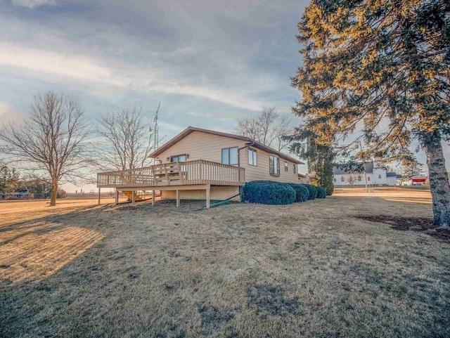 exterior space featuring a yard and a deck