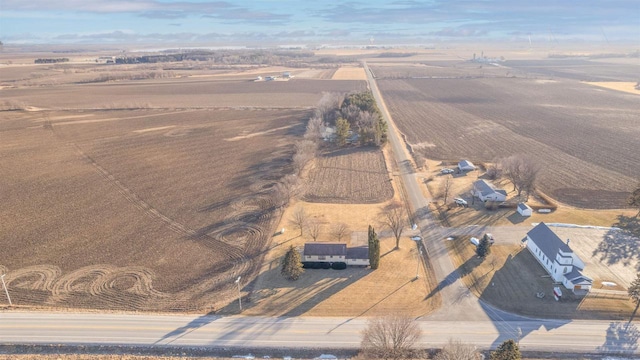 birds eye view of property with a rural view