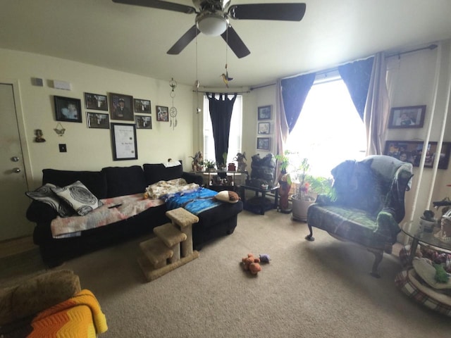 carpeted living room with ceiling fan