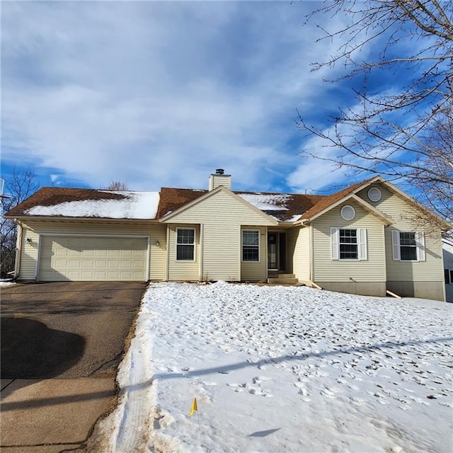 ranch-style house featuring a garage