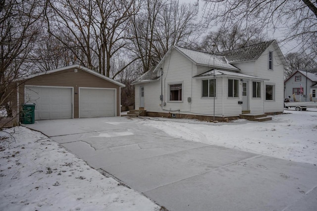 view of front of home featuring an outbuilding and a garage