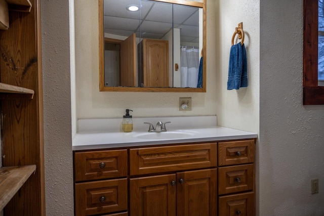 bathroom with vanity and a shower with shower curtain