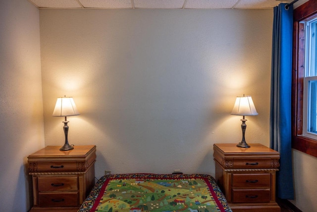 bedroom featuring a paneled ceiling