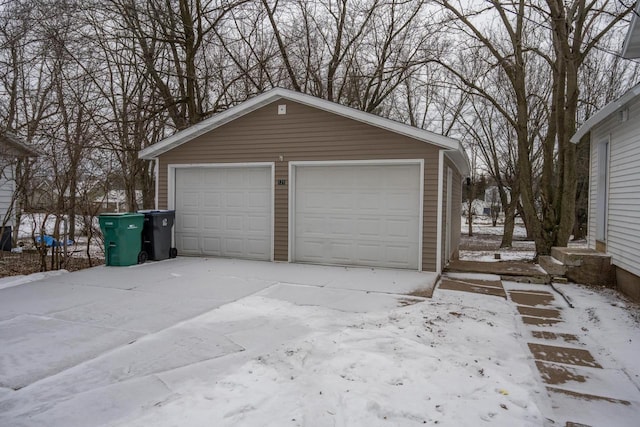 view of snow covered garage