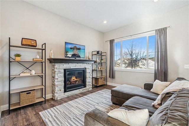 living room featuring dark hardwood / wood-style floors and a fireplace