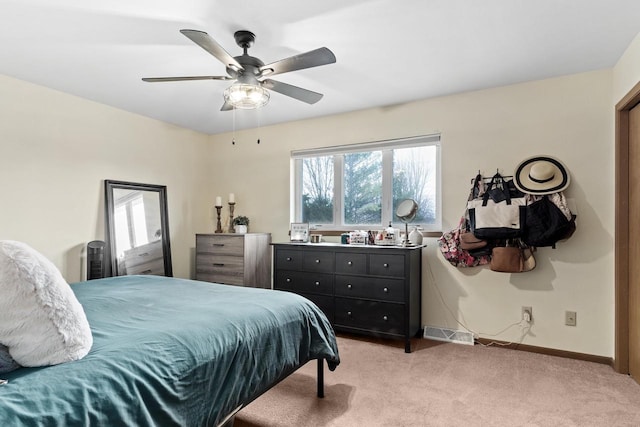 carpeted bedroom with ceiling fan