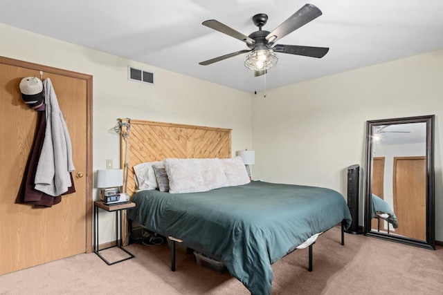 carpeted bedroom with ceiling fan