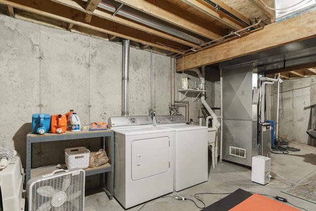 washroom with independent washer and dryer and heating unit