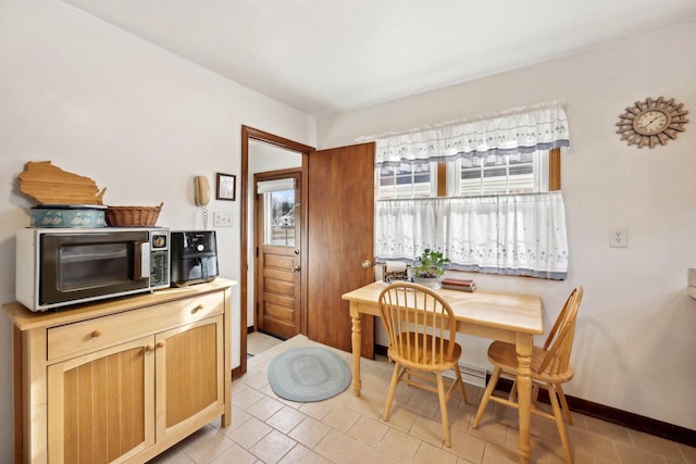 dining area with light tile patterned flooring