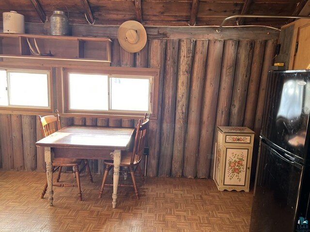 13770 State Highway 13, Herbster, WI 54844 - dining area with parquet flooring, a healthy amount of sunlight, and wood walls