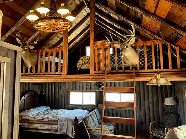 13770 State Highway 13, Herbster, WI 54844 - bedroom with lofted ceiling with beams, wood ceiling, and an inviting chandelier