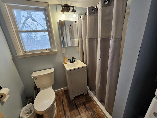 13770 State Highway 13, Herbster, WI 54844 - bathroom with hardwood / wood-style flooring, vanity, a shower with shower curtain, and toilet