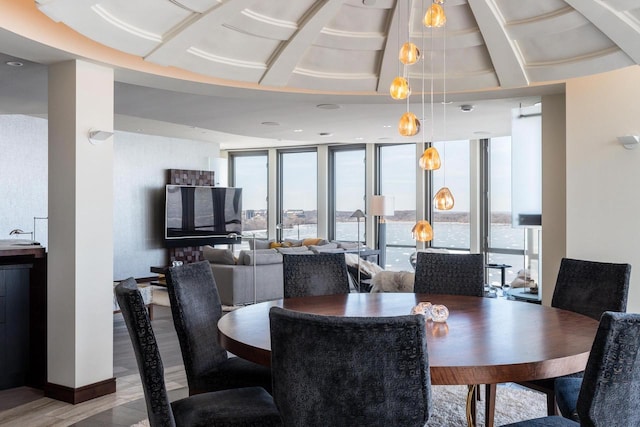 dining room featuring hardwood / wood-style flooring and floor to ceiling windows