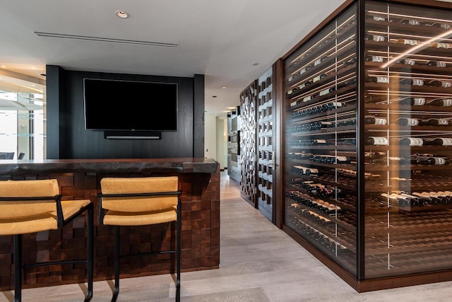 wine area featuring light hardwood / wood-style flooring