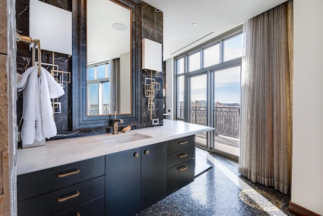 bathroom with vanity and floor to ceiling windows