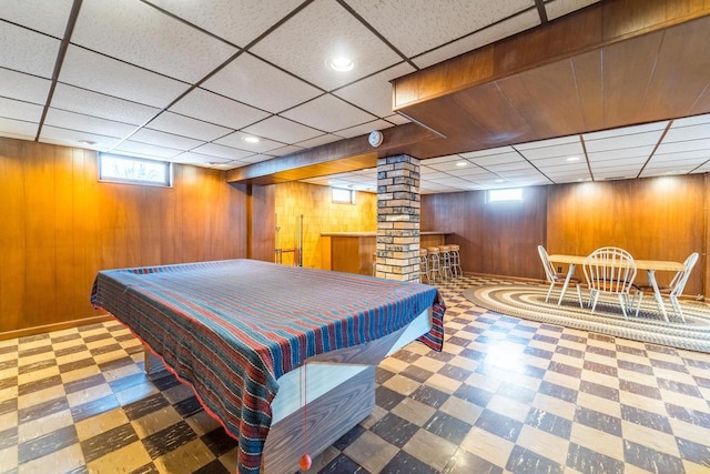 playroom with pool table and wood walls