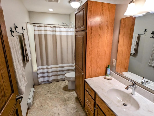 bathroom featuring a baseboard radiator, vanity, and toilet