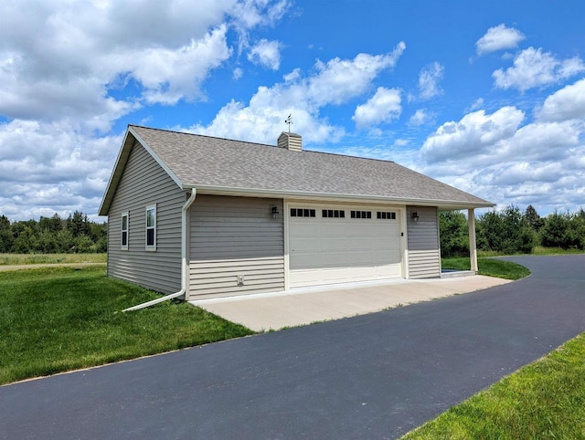 garage with a lawn