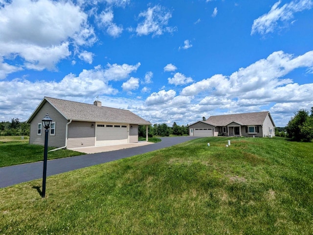 ranch-style home with a garage and a front yard