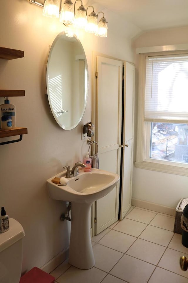 bathroom featuring tile patterned floors and toilet