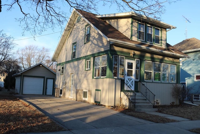 view of front facade featuring an outbuilding and a garage