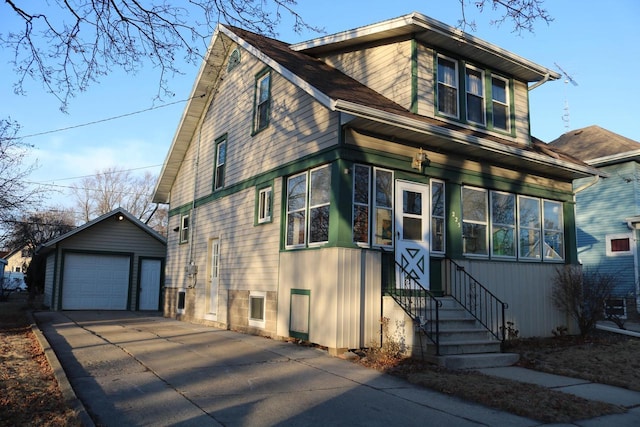 view of front of home featuring a garage and an outdoor structure