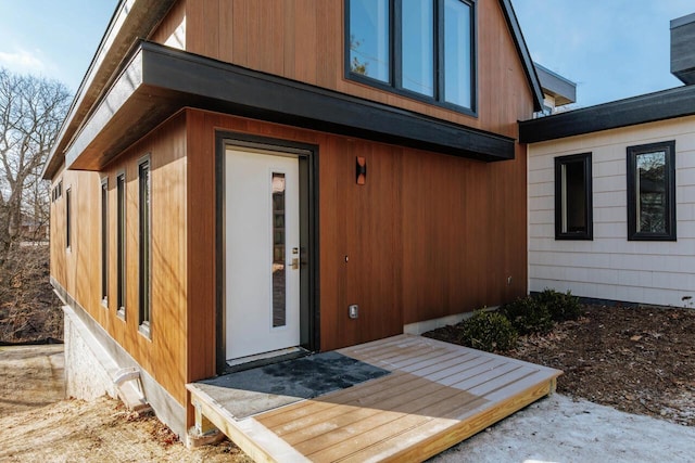 doorway to property featuring a wooden deck