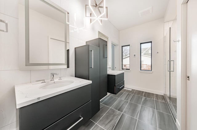 bathroom with vanity and an enclosed shower