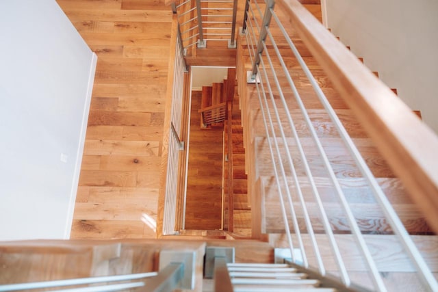 staircase with wood walls