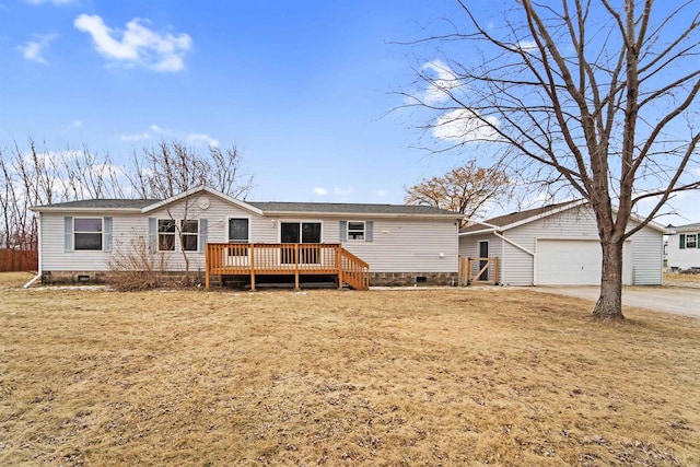 manufactured / mobile home with a deck and a front lawn