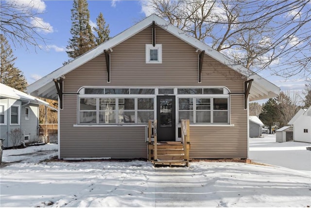 view of snow covered house