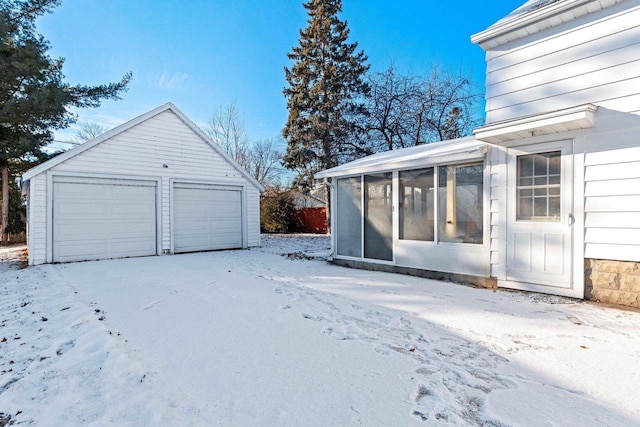 view of snow covered garage