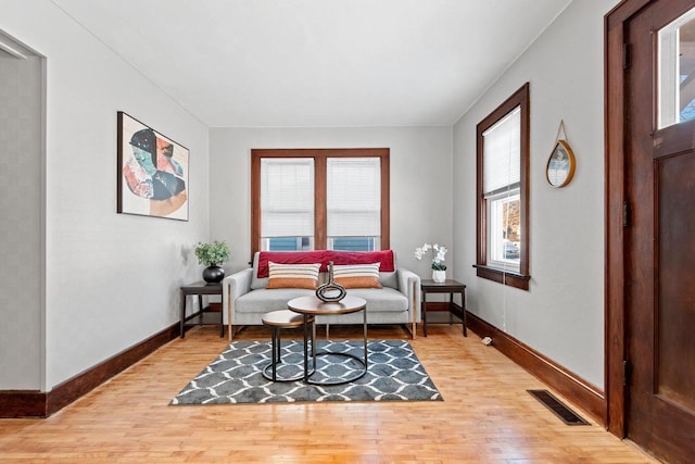 sitting room with light hardwood / wood-style flooring