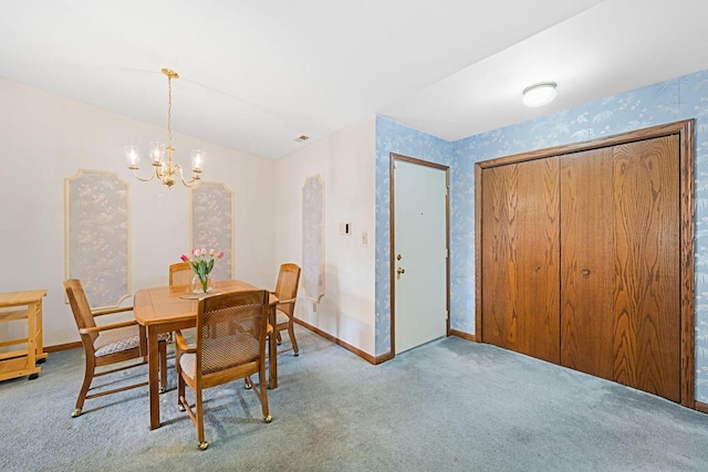 dining space featuring light colored carpet and a notable chandelier