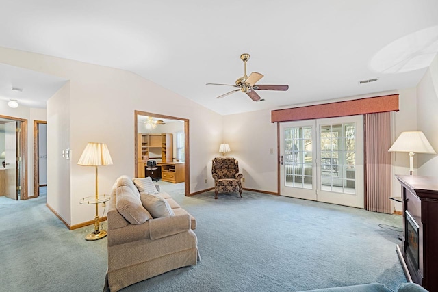 sitting room featuring lofted ceiling, carpet floors, and ceiling fan