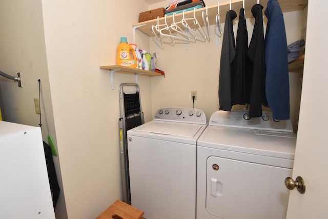 washroom featuring washer and clothes dryer