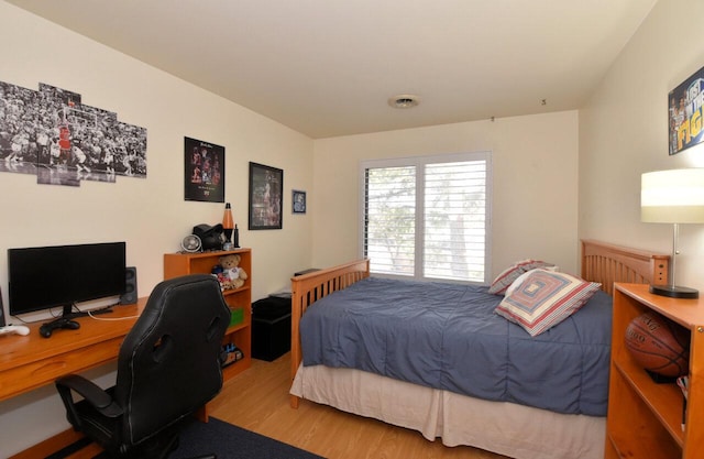 bedroom with light hardwood / wood-style floors