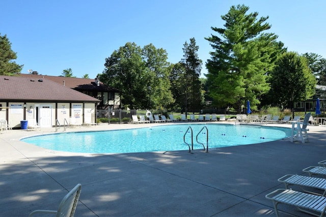 view of swimming pool featuring a patio area