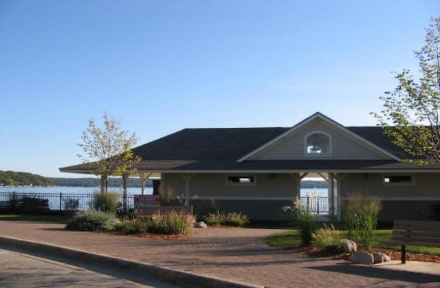 view of front facade with a water view