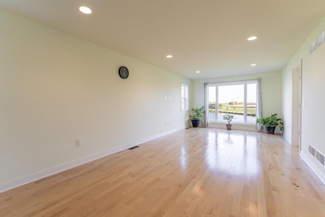 unfurnished room featuring light hardwood / wood-style floors