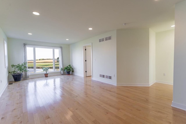 unfurnished room featuring light hardwood / wood-style floors